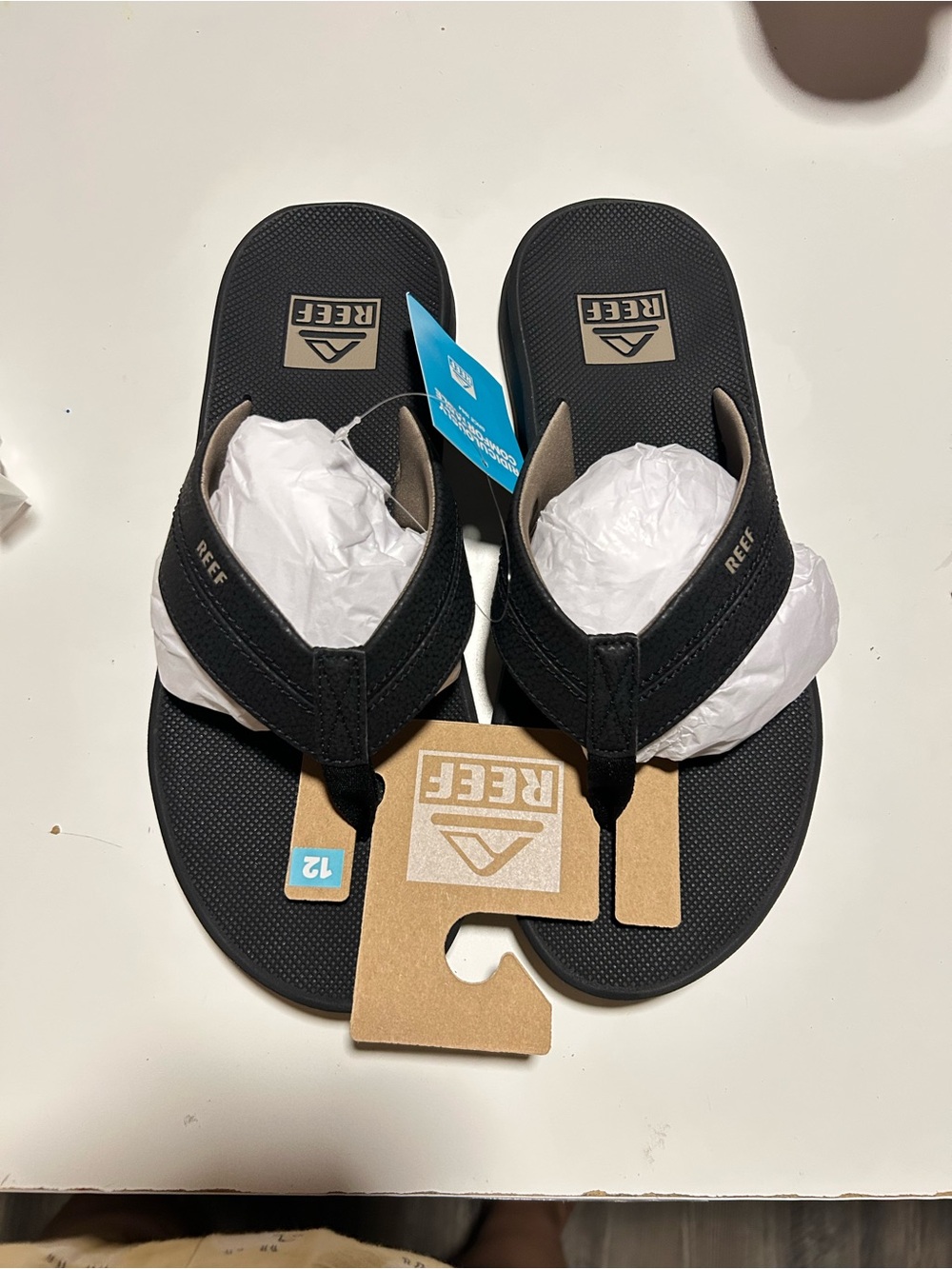 Reef Men's Black Cushion Sandals with bottle oepner